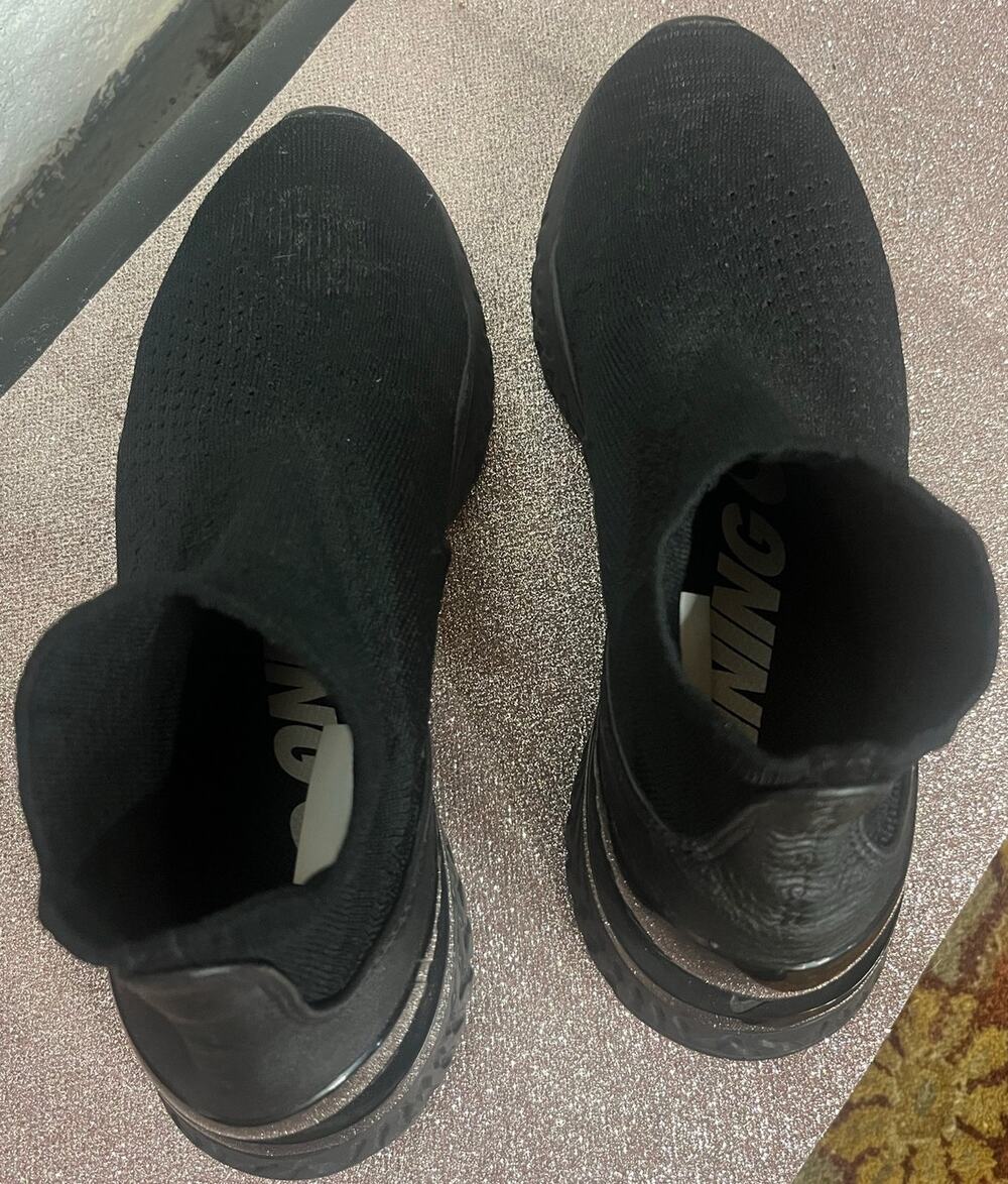 Barely worn Nike Rise React Flyknit Triple Black.